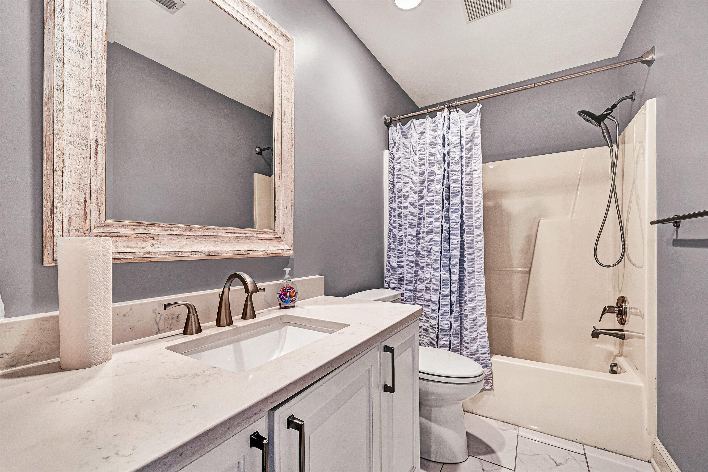 4530 Colonial Pl Drive Roanoke, VA 24018 - Photo 20 of 39 a bathroom with a sink a toilet and shower