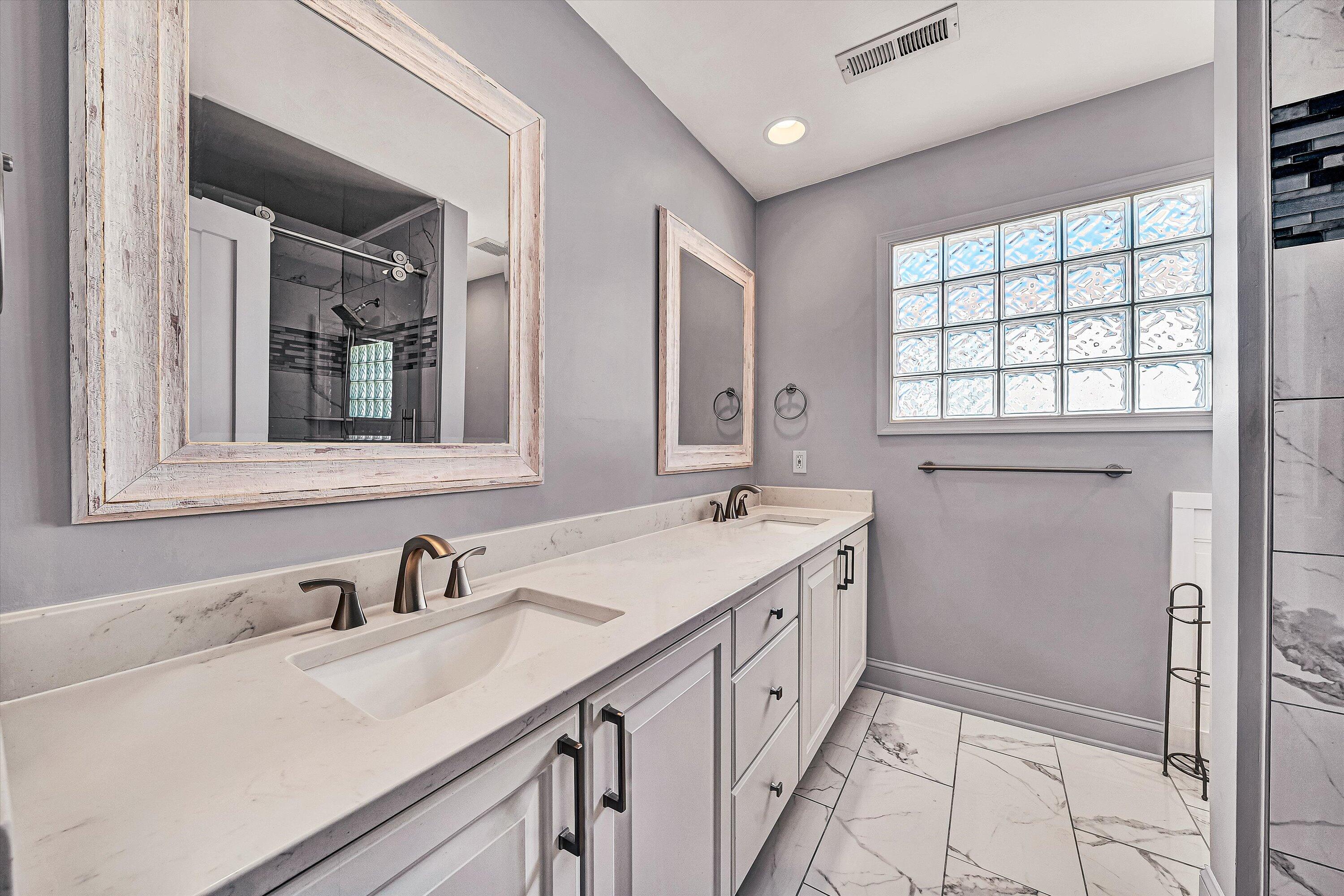 4530 Colonial Pl Drive Roanoke, VA 24018 - Photo 24 of 39 a bathroom with a double vanity sink mirror and double