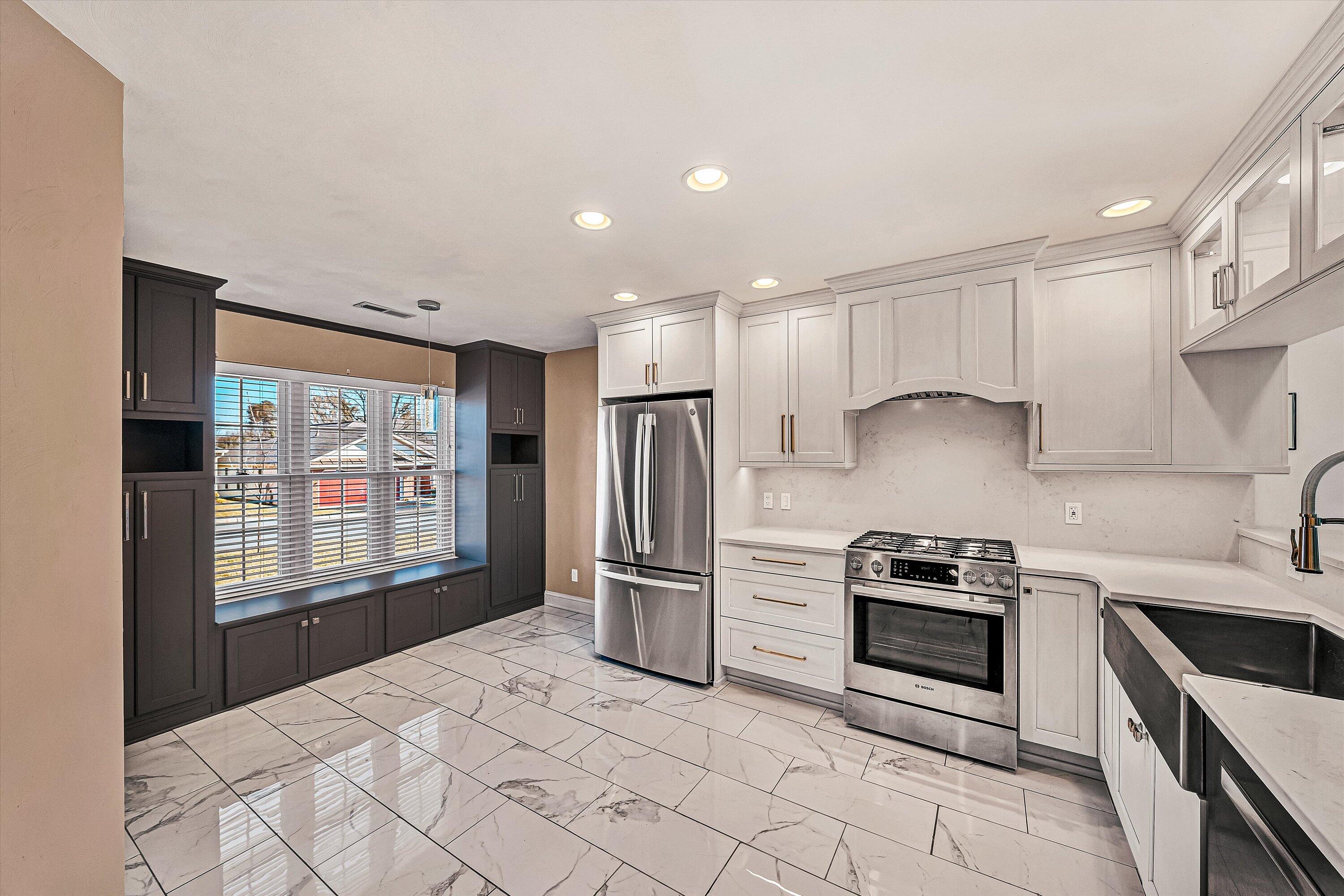 4530 Colonial Pl Drive Roanoke, VA 24018 - Photo 7 of 39 a kitchen with stainless steel appliances a refrigerator sink and stove