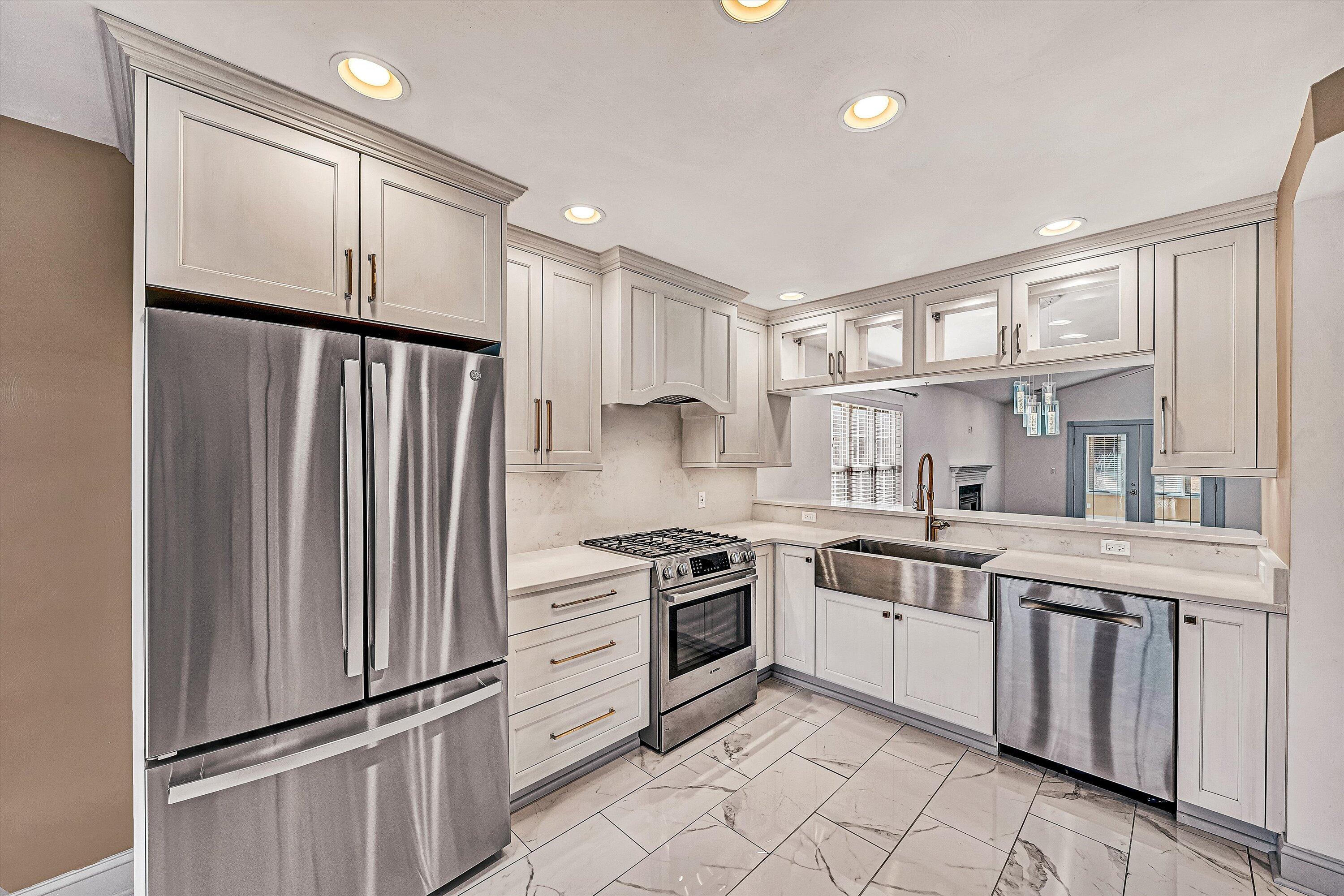 4530 Colonial Pl Drive Roanoke, VA 24018 - Photo 9 of 39 a kitchen with white cabinets stainless steel appliances and a window