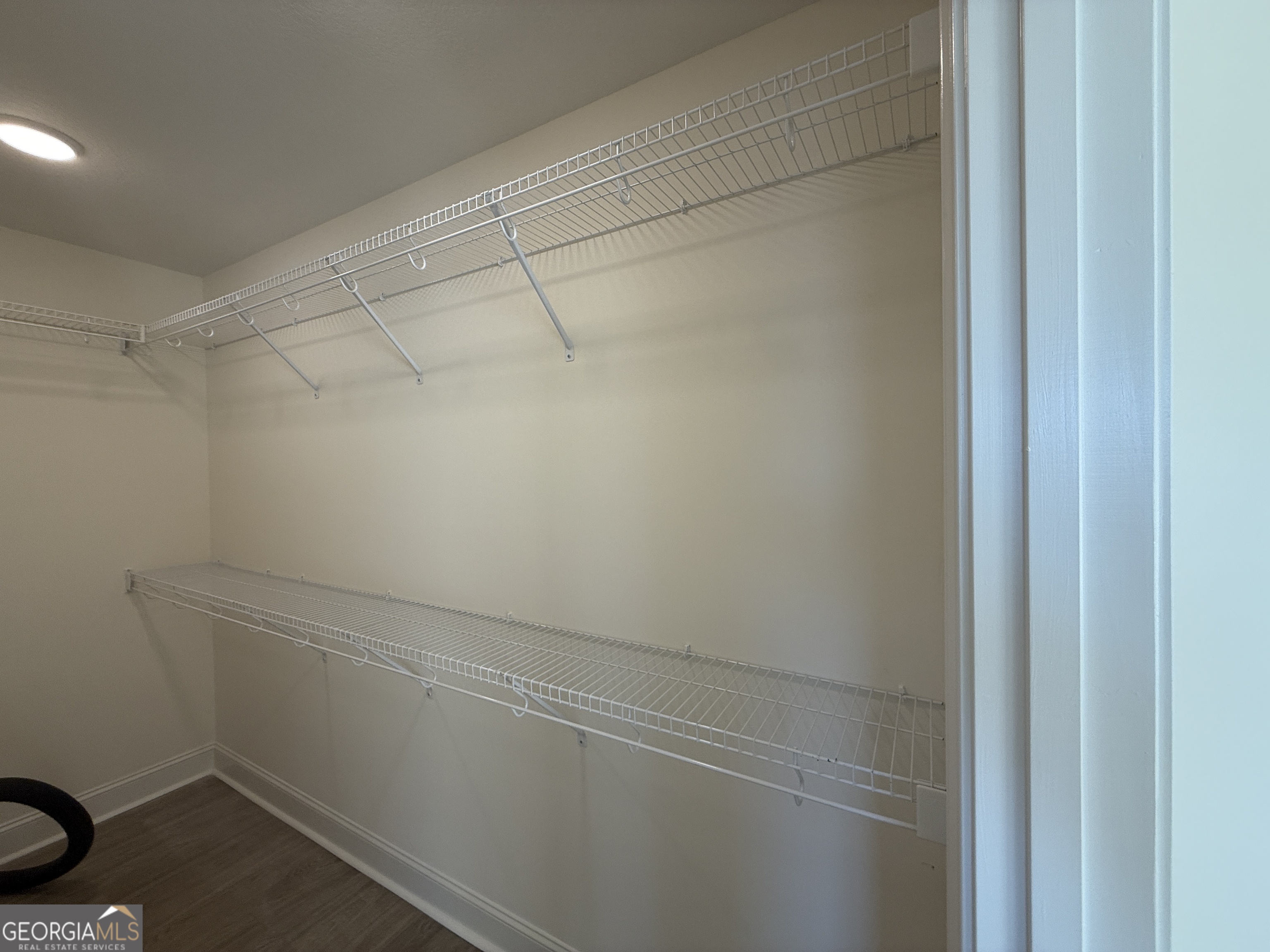 304 Womack Road South Portal, GA 30450 - Photo 11 of 19 a view of a room with racks on the wall