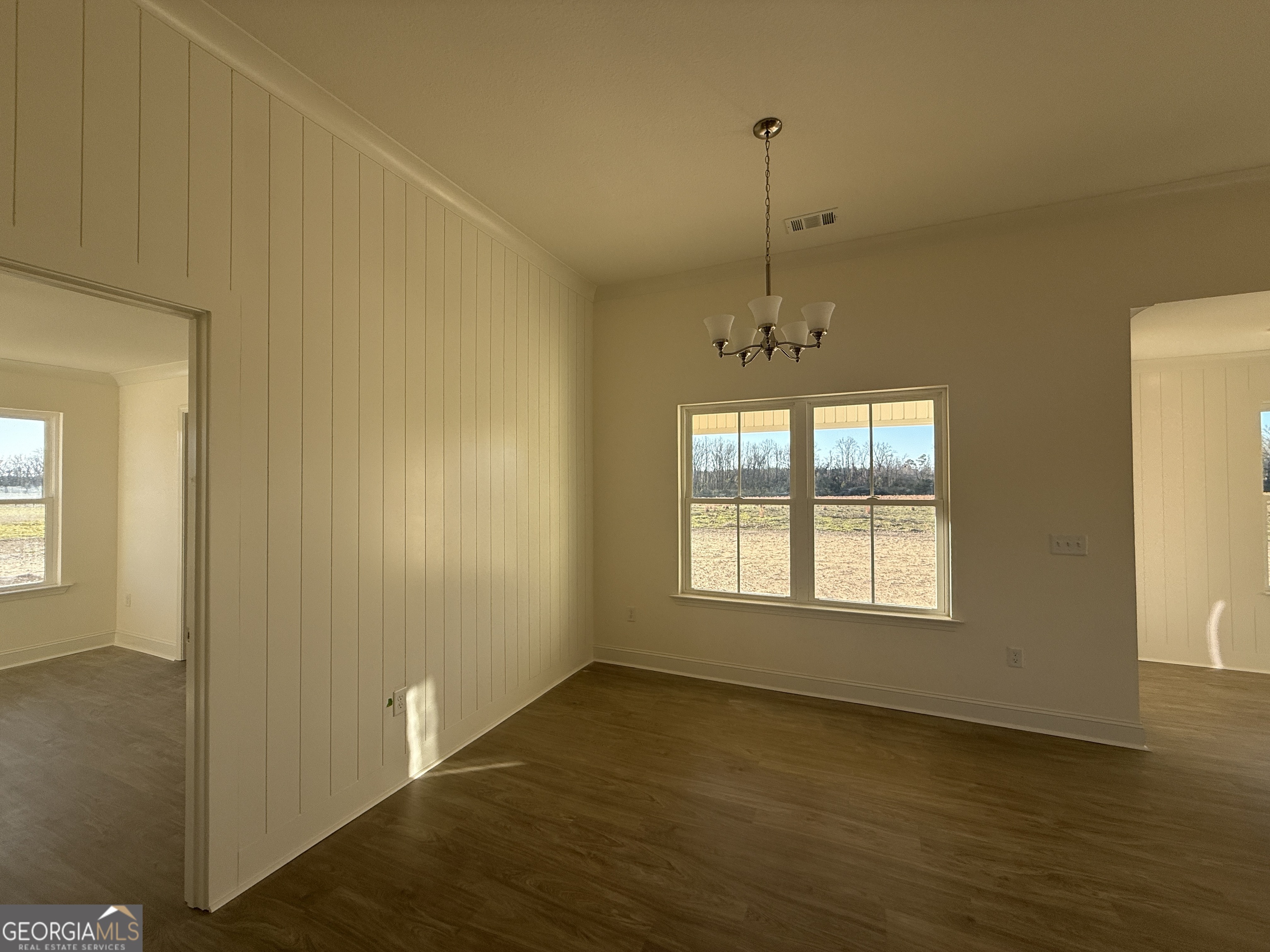 304 Womack Road South Portal, GA 30450 - Photo 5 of 19 a view of an empty room with a window