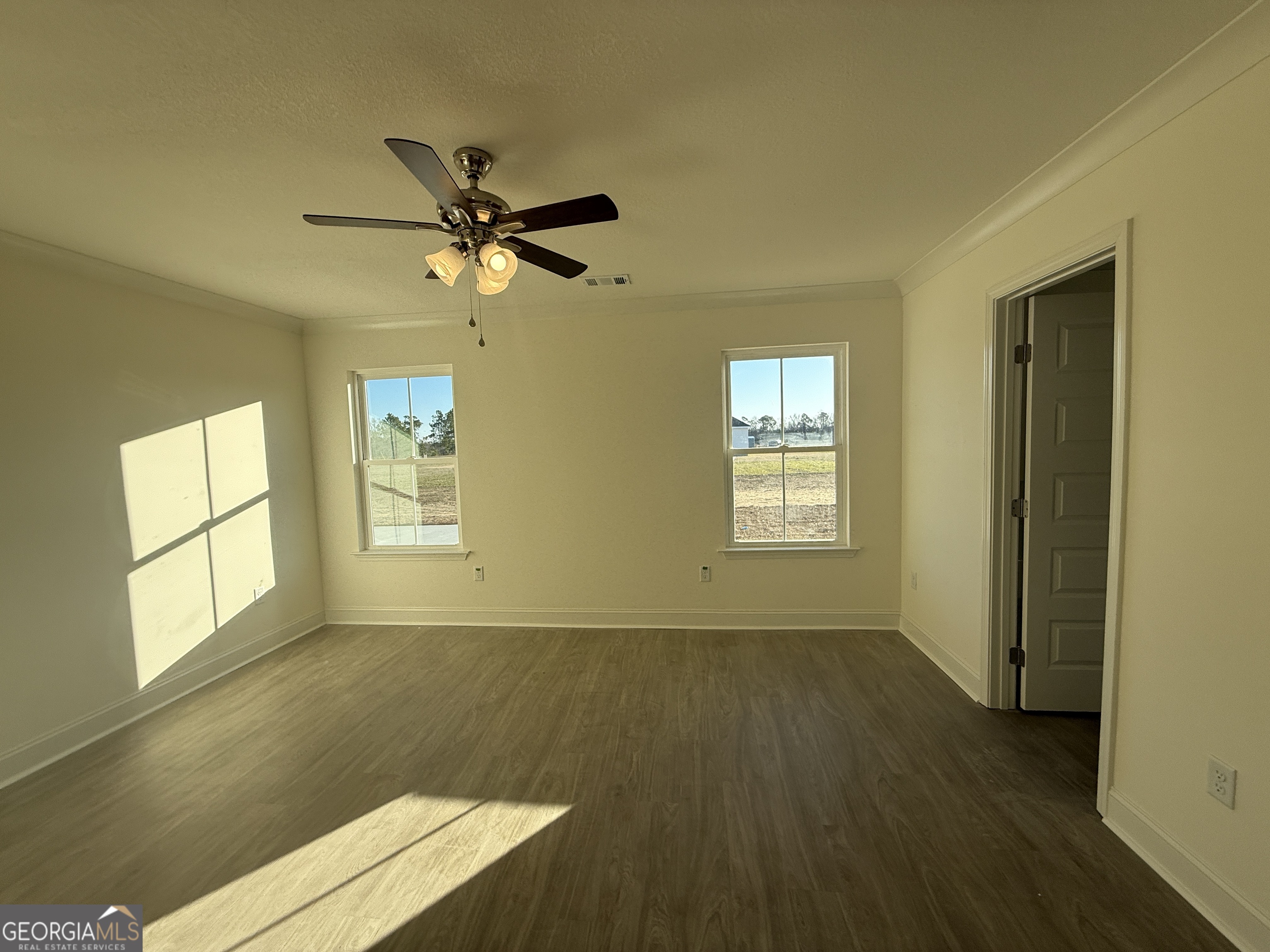 304 Womack Road South Portal, GA 30450 - Photo 10 of 19 a view of room with a ceiling fan and window