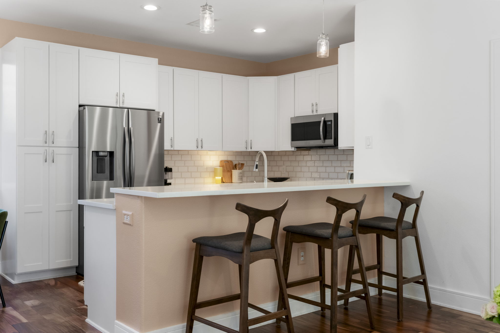 1148 Webberville Road, Unit 6 Austin, TX 78721 - Photo 11 of 34 a kitchen with stainless steel appliances granite countertop a table and chairs in it