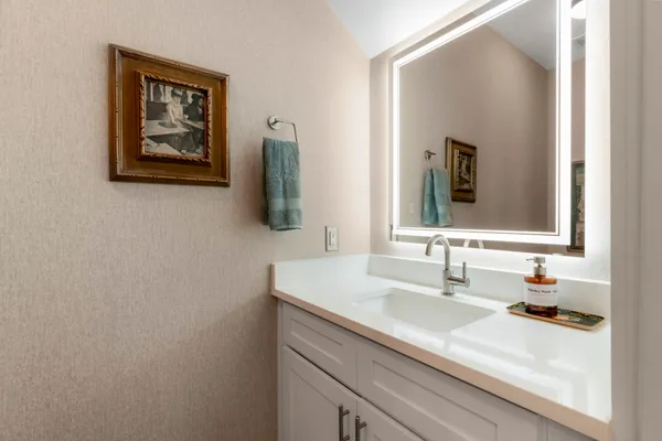 a bathroom with a sink and a mirror