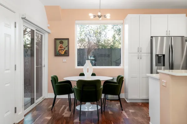 a view of a dining room with furniture window and wooden floor