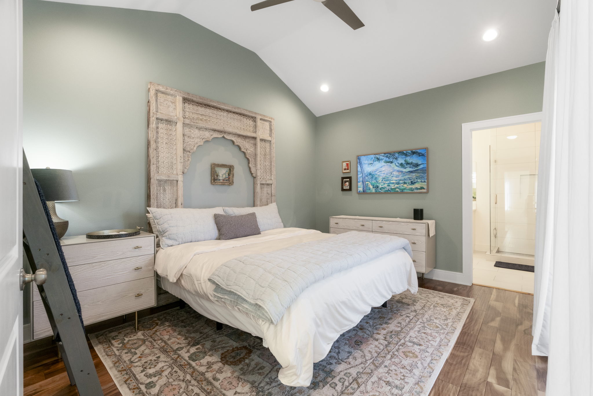 1148 Webberville Road, Unit 6 Austin, TX 78721 - Photo 18 of 34 a bedroom with a bed and a mirror