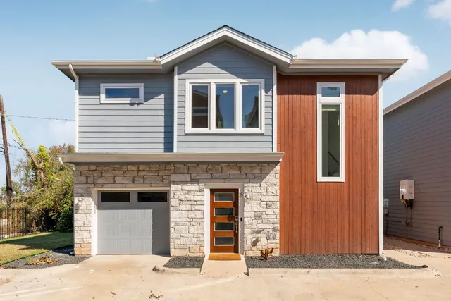 a front view of a house with yard