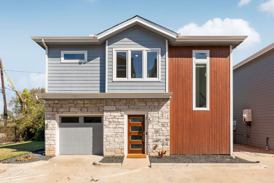 1148 Webberville Road, Unit 6 Austin, TX 78721 - Photo 2 of 34 a front view of a house with yard