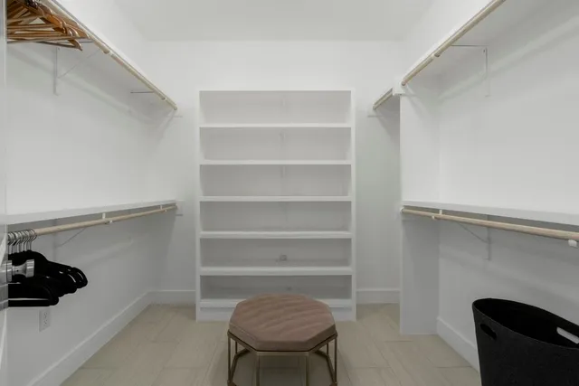 a room with a closet and a chair