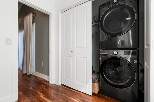 a view of a hallway with washer and dryer