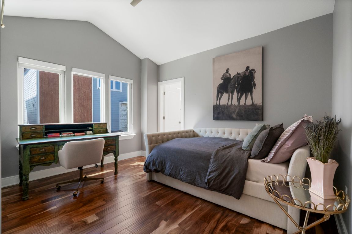 1148 Webberville Road, Unit 6 Austin, TX 78721 - Photo 25 of 34 a bedroom with furniture and a window