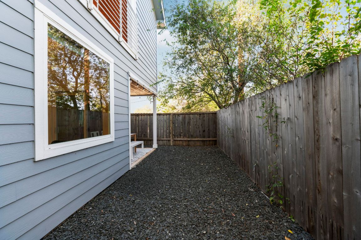 1148 Webberville Road, Unit 6 Austin, TX 78721 - Photo 33 of 34 a view of a house with a yard