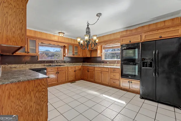a kitchen with stainless steel appliances granite countertop a sink counter space cabinets and stainless steel appliances