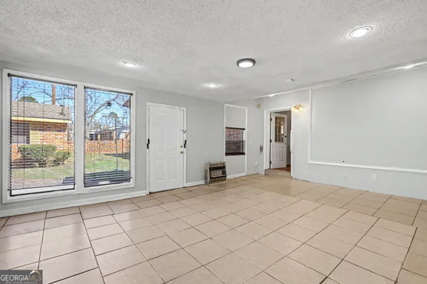a view of an empty room with a window