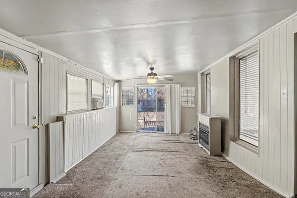 a view of a hallway with windows