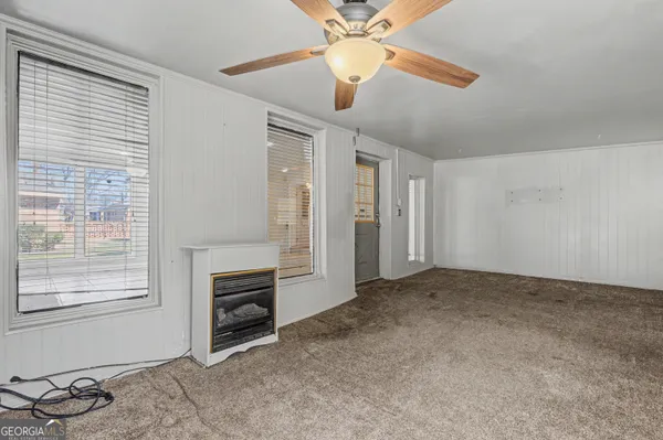 a view of an empty room with a window