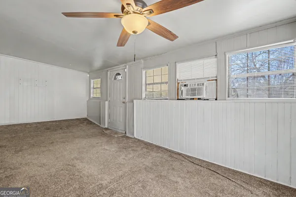 a view of an empty room with a window