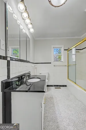 a kitchen with a sink and a refrigerator