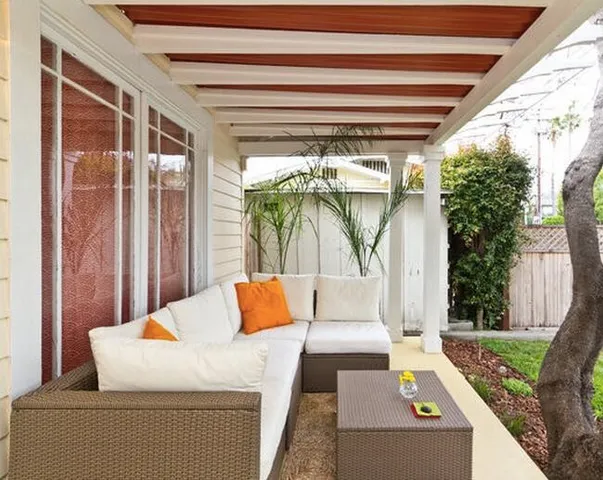 a room with wooden floor pool table and chairs