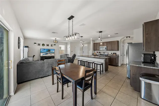 a bedroom with a bed and a view of balcony