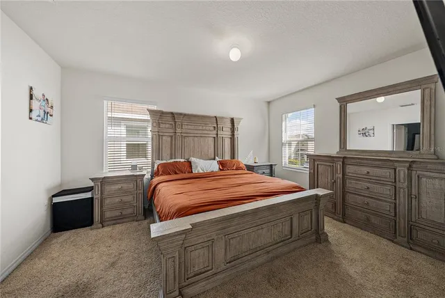 a bathroom with a shower and a glass door
