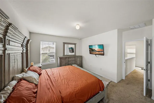 a en suite bathroom with a double vanity sink and a mirror