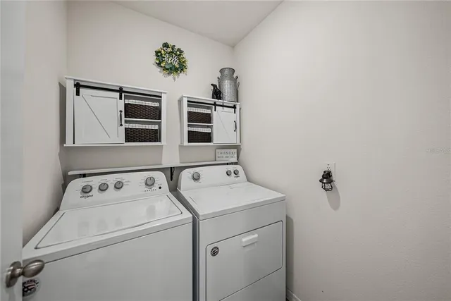 a view of a lake with houses in the background