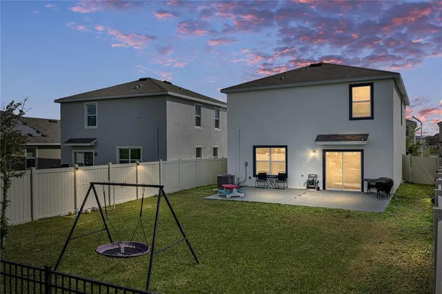 a view of a garden with a building in the background
