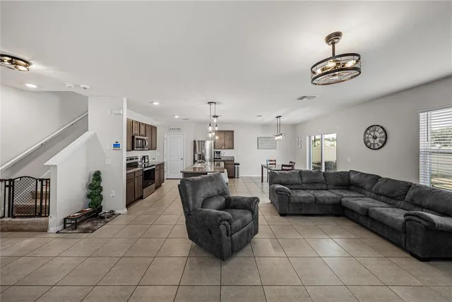 a living room with furniture and a window