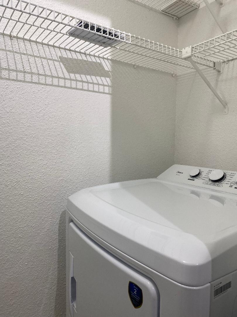 755 Riverside Drive, Unit 1337 Coral Springs, FL 33071 - Photo 19 of 37 a utility room with dryer and washer