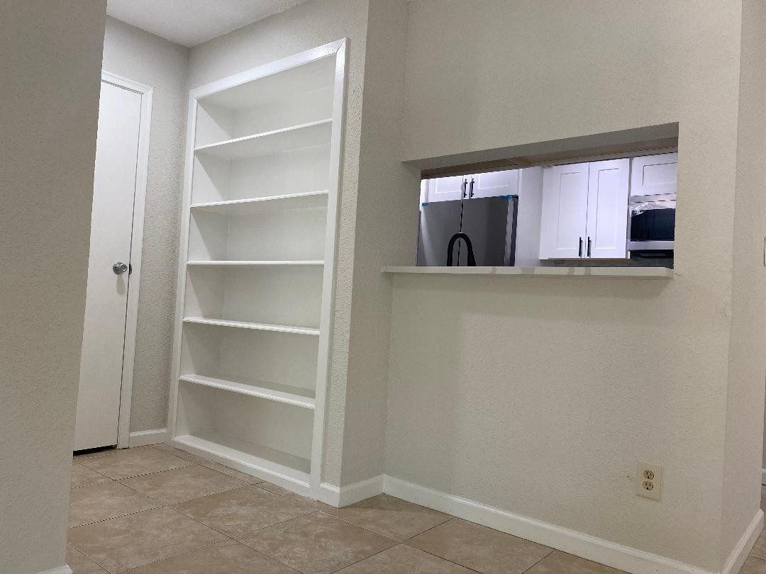 755 Riverside Drive, Unit 1337 Coral Springs, FL 33071 - Photo 22 of 37 a view of cabinets and window in a room