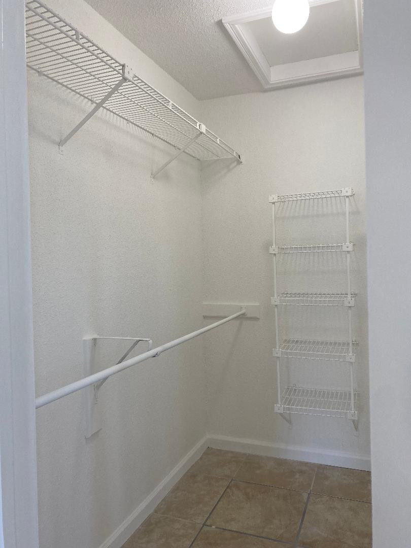 755 Riverside Drive, Unit 1337 Coral Springs, FL 33071 - Photo 23 of 37 a view of an empty walk in closet
