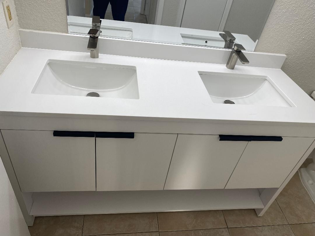 755 Riverside Drive, Unit 1337 Coral Springs, FL 33071 - Photo 31 of 37 a bathroom with a sink and a mirror