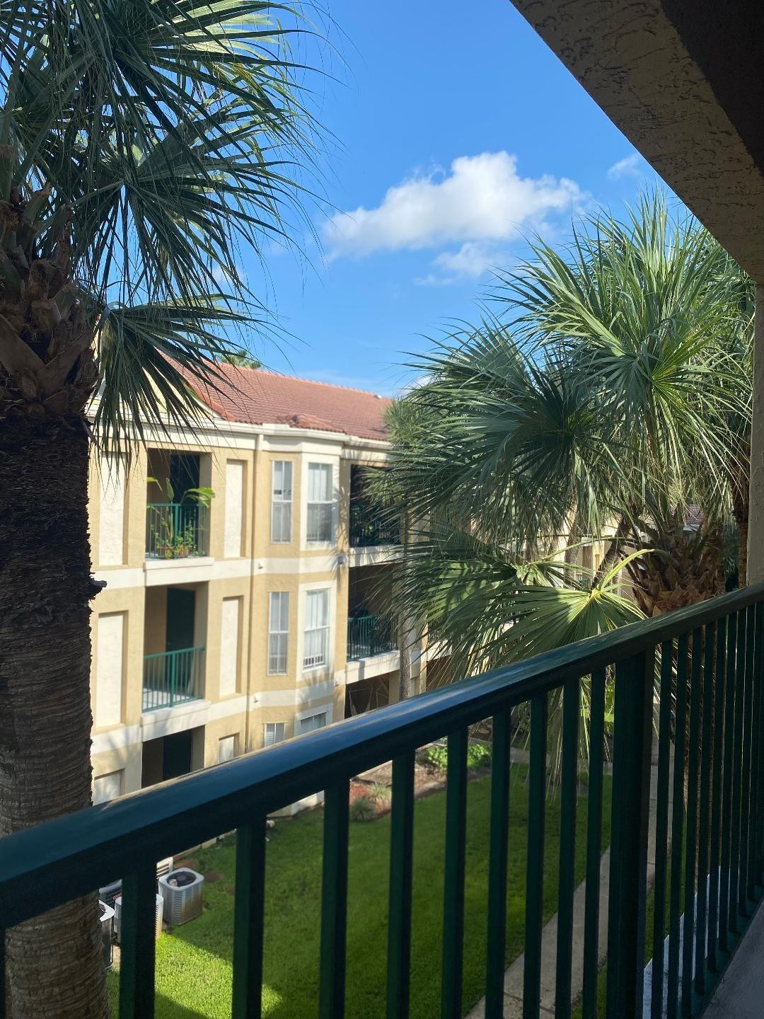 755 Riverside Drive, Unit 1337 Coral Springs, FL 33071 - Photo 33 of 37 a view of a balcony with a tree