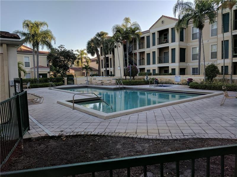 755 Riverside Drive, Unit 1337 Coral Springs, FL 33071 - Photo 37 of 37 a view of a house with backyard and sitting area