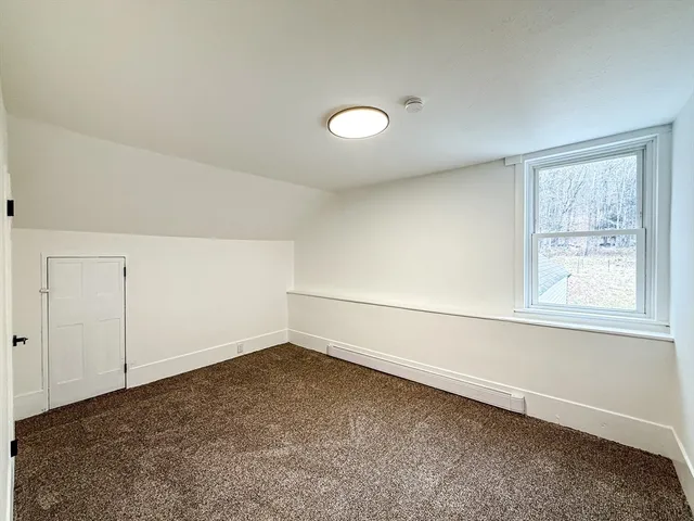 an empty room with a empty space and window