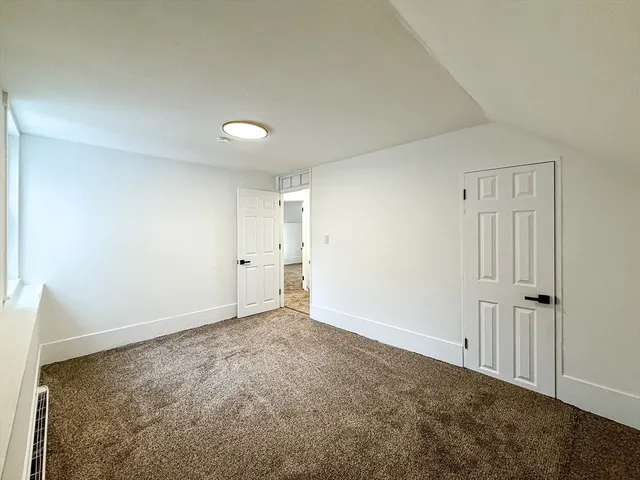 an empty room with a empty space and window