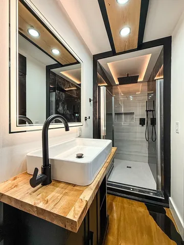 a bathroom with a sink and a mirror
