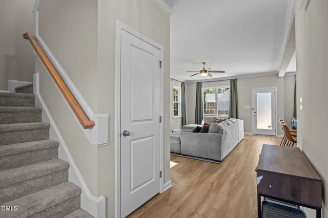 a very nice looking room with wooden floor and furniture