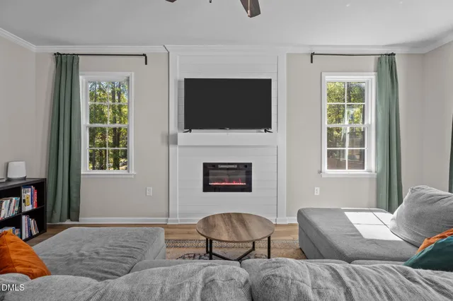 a living room with furniture and a flat screen tv