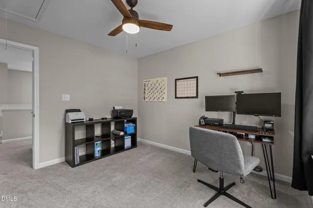 a view of a workspace with furniture