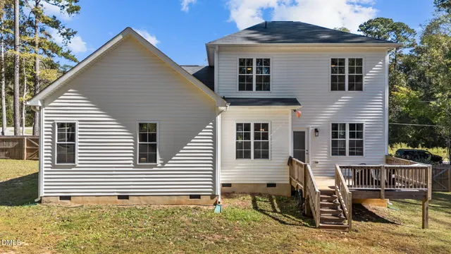 a view of backyard with deck