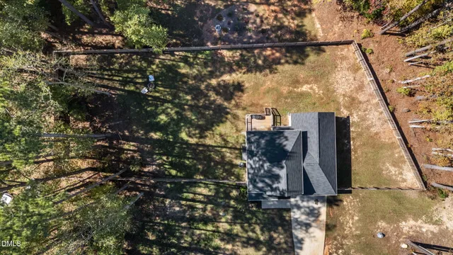 a view of a house with a tree