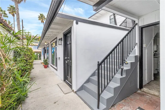 a view of a porch with wooden floor and staircase