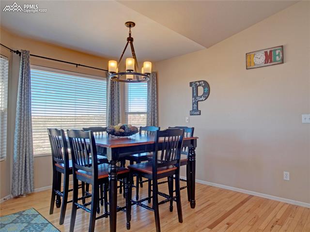 11601 Rio Secco Road Peyton, CO 80831 - Photo 18 of 36 Dining nook with wood floors and Mountain Views