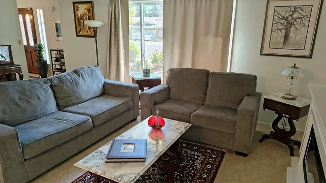 a living room with furniture and a window