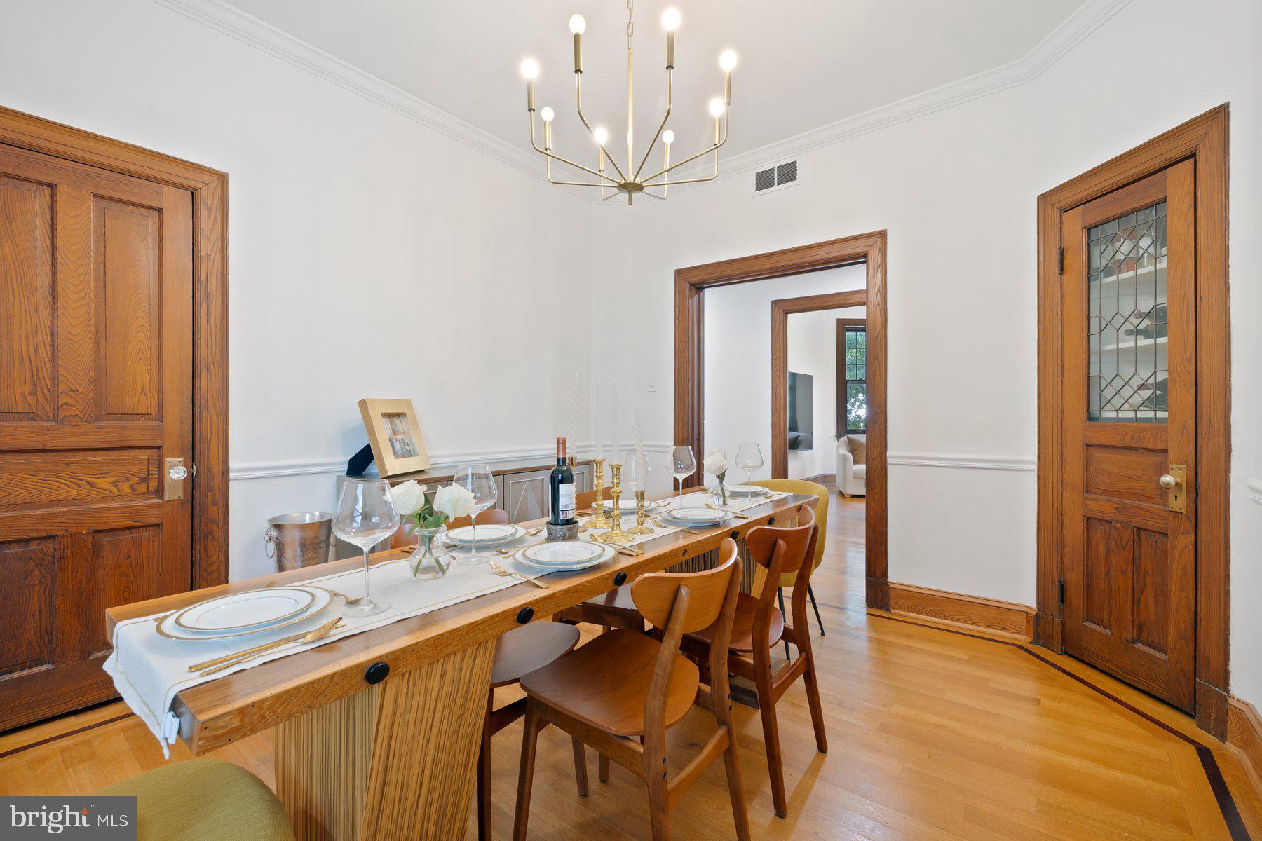 3020 Dent Place Northwest, Unit 30W Washington, DC 20007 - Photo 11 of 37 a view of a dining room with furniture and a chandelier