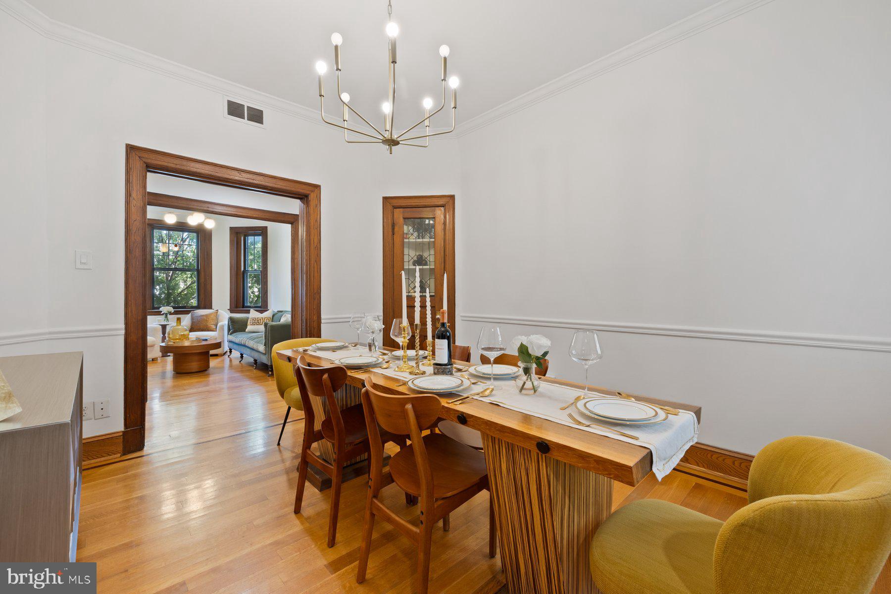 3020 Dent Place Northwest, Unit 30W Washington, DC 20007 - Photo 12 of 37 a view of a dining room with furniture and wooden floor