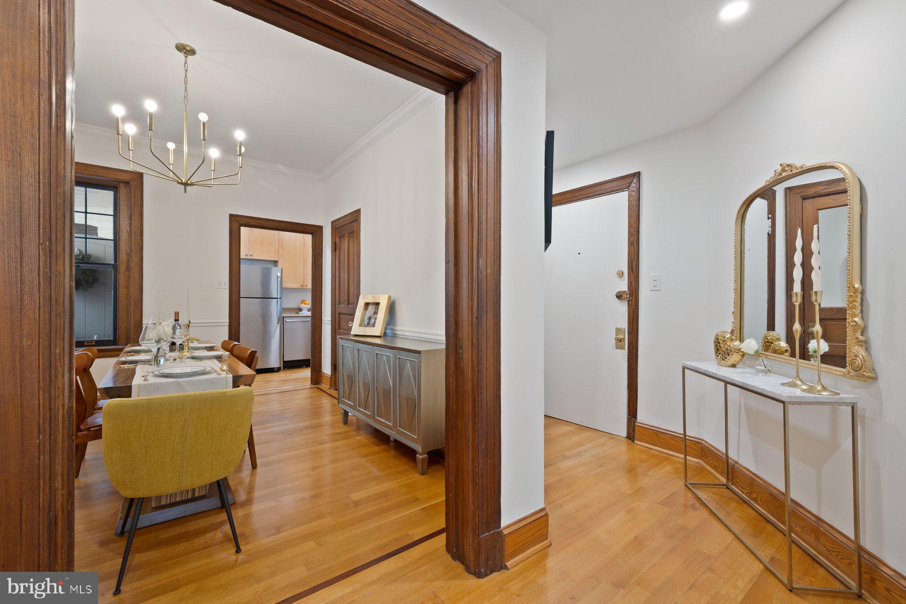 3020 Dent Place Northwest, Unit 30W Washington, DC 20007 - Photo 3 of 37 a view of a hallway with furniture and chandelier